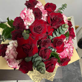 Bouquet of red roses and pink hydrangeas with eucalyptus