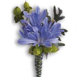 Blue flower boutonniere with green accents and wrapped stem