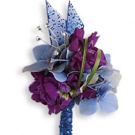 Purple and blue floral corsage with glittered accents