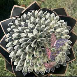 Bouquet made of folded dollar bills with butterfly decorations