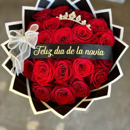 Bouquet of red roses with a tiara and ribbon banner