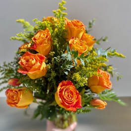 Bouquet of orange roses with yellow filler flowers