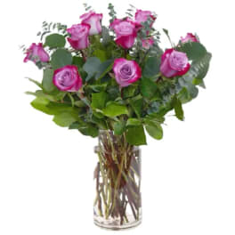 Bouquet of pink roses in a clear glass vase