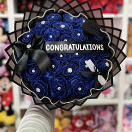 Blue rose bouquet with a congratulations ribbon and black wrapping