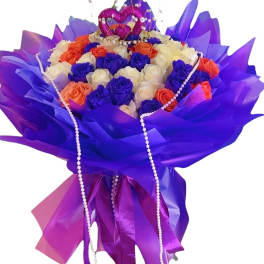 Bouquet of purple, white, and orange roses with pearl strands