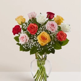 Mixed roses in a clear glass vase