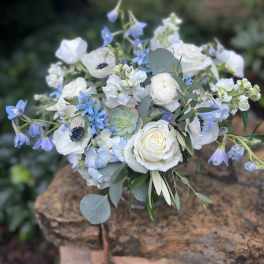 White and blue mixed bouquet with roses and ranunculus