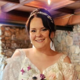 Bride holding a cascading bouquet of pink and white flowers