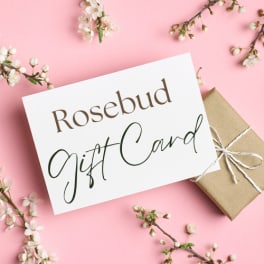 Rosebud gift card with a wrapped present on pink background