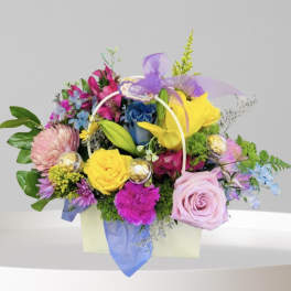 Colorful mixed flower basket with roses, lilies, and chrysanthemums