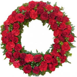 Circular wreath of red roses and carnations