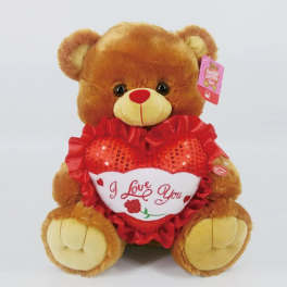 Brown teddy bear holding a red heart with "I Love You" text