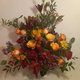 Large mixed bouquet with roses, lilies, and alstroemeria in a vase