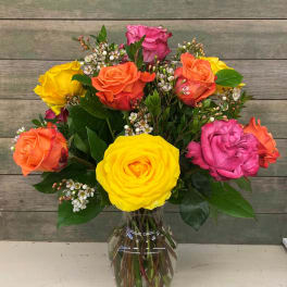 Colorful rose bouquet in a clear glass vase