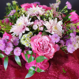Pink rose bouquet with pale chrysanthemums and purple daisies