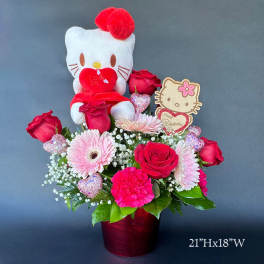Hello Kitty plush in a red rose and pink flower arrangement