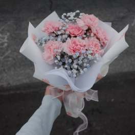 Fresh pink carnations with baby's breath