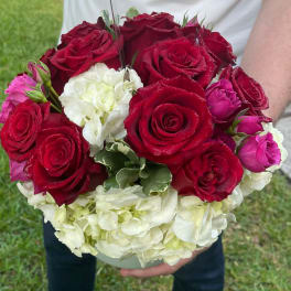 Bouquet of red roses with white hydrangeas and pink rosebuds