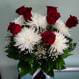 Bouquet of red roses and white spider mums with baby's breath
