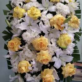 Yellow roses and white lilies with white chrysanthemums in a large spray