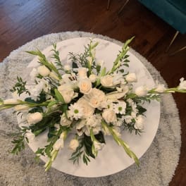 White floral arrangement on a round table