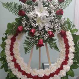 Standing floral wreath with red roses and white lilies