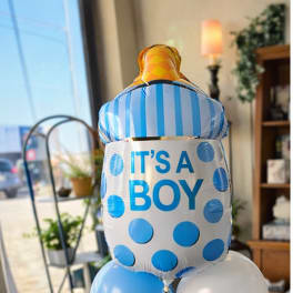 Blue and white baby shower balloons with an "IT'S A BOY" foil balloon
