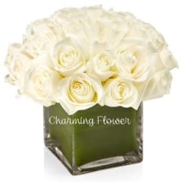 White rose bouquet in a square glass vase