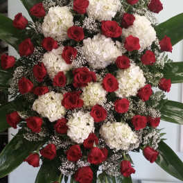 Large standing floral spray with red roses and white hydrangeas