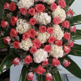 Large standing floral spray with pink roses and white hydrangeas