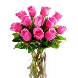 Pink roses arranged in a clear glass vase