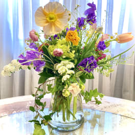 Colorful mixed bouquet in a clear glass vase