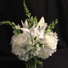 White floral bouquet in a clear glass vase