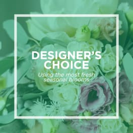 Designer’s choice floral arrangement with white and pale purple blooms