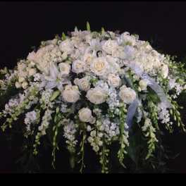 Large white floral spray with roses and lilies