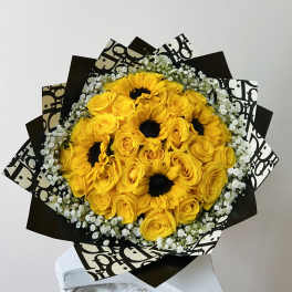 Yellow roses and sunflowers in black-and-white wrapping
