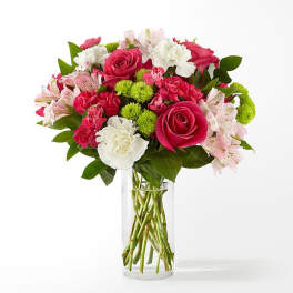 Bouquet of pink and white flowers in a clear glass vase