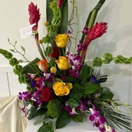 Tall tropical bouquet with red ginger, roses, and purple orchids