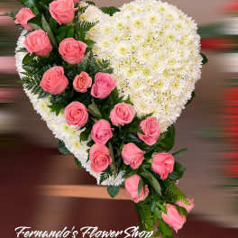 Heart-shaped standing spray of white mums with cascading pink roses on one side
