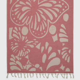 Pink and cream butterfly-patterned woven rug with fringe