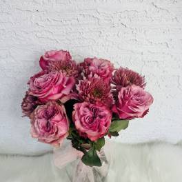 Pink rose bouquet with chrysanthemum blooms tied with a sheer ribbon