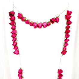 Pink rose rosary with a purple bow and cross pendant