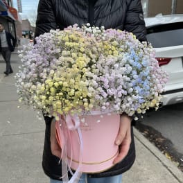 Large pastel bouquet of baby's breath in a pink hat box