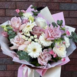 Bouquet of pink and white roses with white daisies and eucalyptus