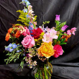 Colorful mixed bouquet in a clear glass vase