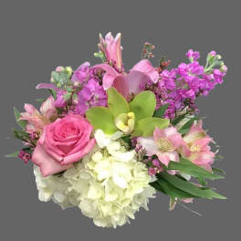 Pink and white mixed bouquet with roses, lilies, hydrangea, and orchids