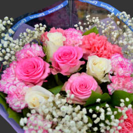 Bouquet of pink and white roses with carnations and baby's breath