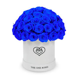 Blue roses arranged in a white hat box with a heart logo