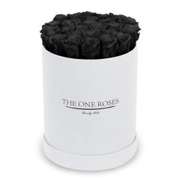 Black roses arranged in a white round box
