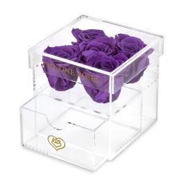 Purple roses in a clear acrylic box with a drawer